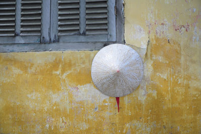 Conical hat on weathered wall