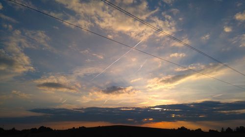 Scenic view of cloudy sky at sunset