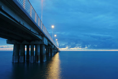 Pier over sea against sky