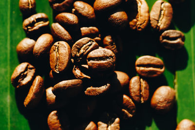 Close-up of coffee beans on table