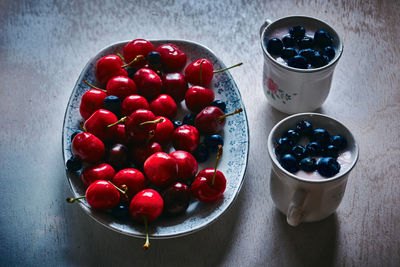 High angle view of strawberries in bowl on table