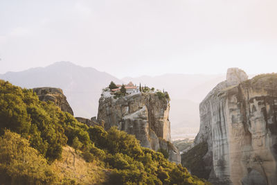 View of cliff against cloudy sky