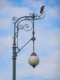 Low angle view of street light against sky