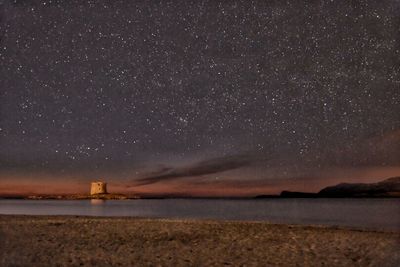 Scenic view of sea against sky at night