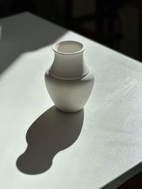 Close-up of wedding rings on table