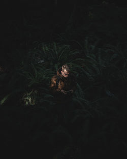 Portrait of young woman in the dark