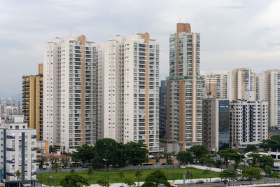 Skyscrapers in city against sky