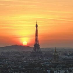 Tower in city during sunset