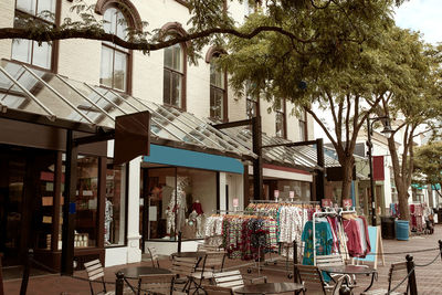 People on street amidst buildings in city