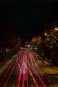 Light trails on street in city at night