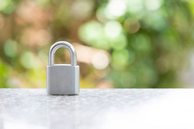 Close-up of padlock on table