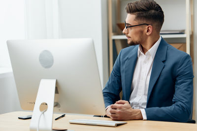 Businessman working at desk in office