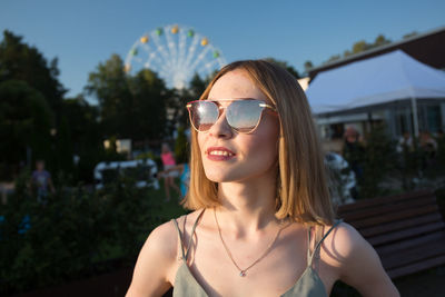 Portrait of young woman wearing sunglasses