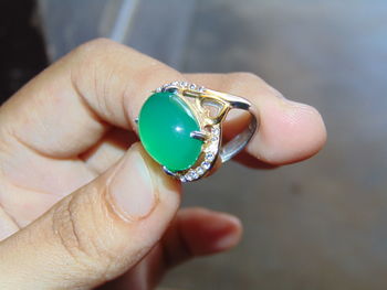 Close-up of hand holding ring