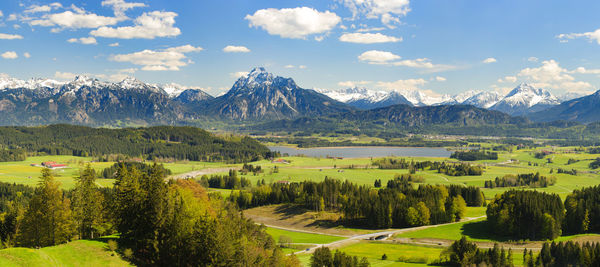 Scenic view of landscape and mountains against sky