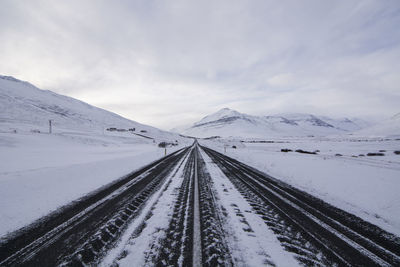 Tire tracks on road during winter