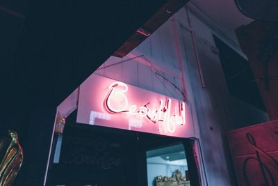 Low angle view of illuminated building at night