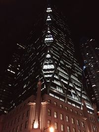 Low angle view of illuminated building at night