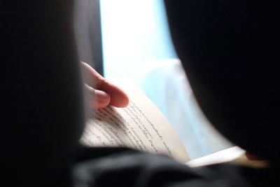 Close-up of hand holding book