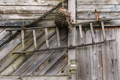 High angle view of rope tied on metal wall