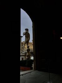 Statue against sky at night