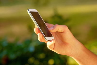 Close-up of person using mobile phone