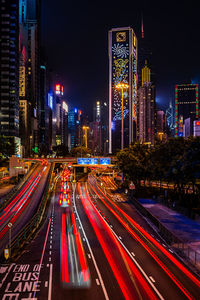 High angle view of light trails on city at night