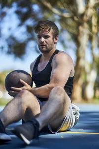 Man playing with ball at park