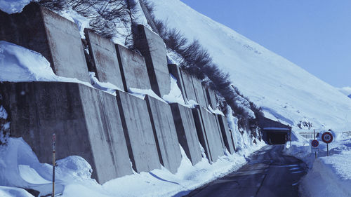 Panoramic shot of snow covered mountain against sky