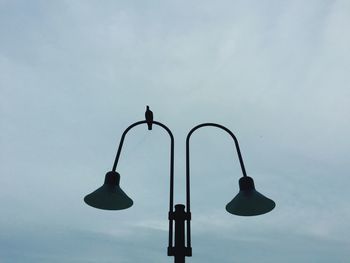 Low angle view of street light against sky