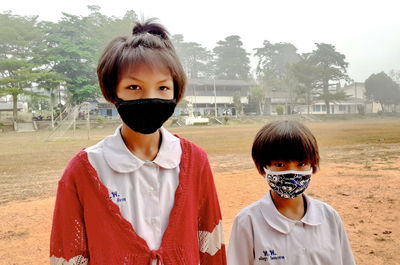 Portrait of boy standing outdoors