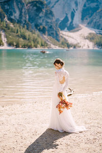 Woman with umbrella on beach