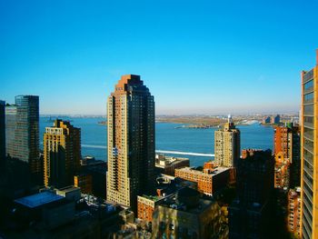 City skyline against blue sky