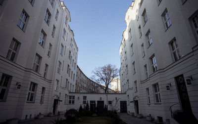 Low angle view of buildings against blue sky