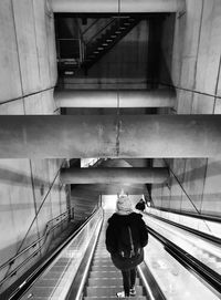 Rear view of man on staircase in building