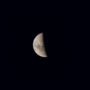 Low angle view of moon against sky at night