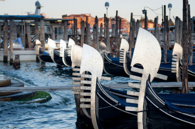 Boats moored at harbor