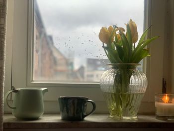 Close-up of glass vase on table at home