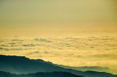 Scenic view of dramatic sky over mountains