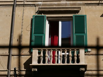 Low angle view of multi colored windows in building