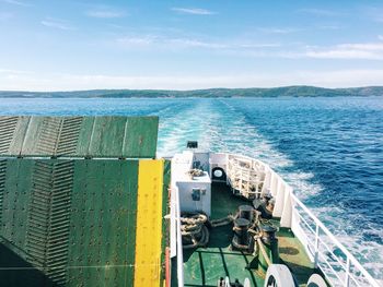 Ferry boat sailing in sea against sky