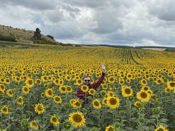 Scenic view of sunflower field against sky