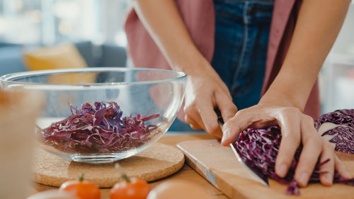 Midsection of woman preparing food