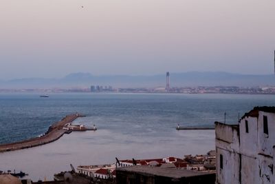 High angle view of buildings in city during sunset