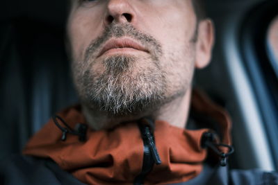 Close-up portrait of man wearing mask