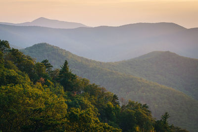 Scenic view of mountains against sky during sunset