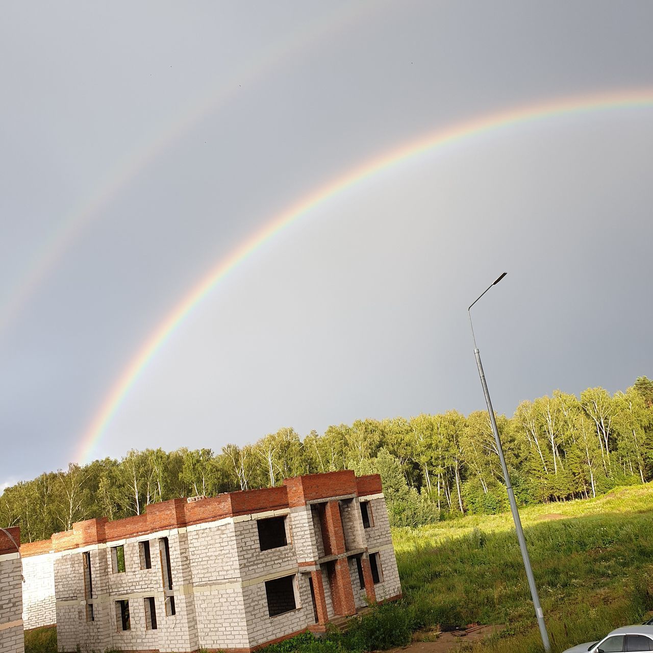 PANORAMIC VIEW OF RAINBOW AGAINST SKY