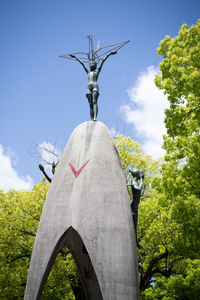 Low angle view of statue against sky