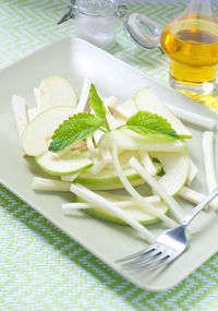 High angle view of vegetables in plate on table