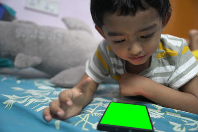 Close-up of boy drawing on paper